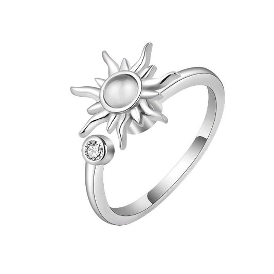 Sterling silver ring with sun center piece. The adjustable ring has a spinning center sun. Give a spin to the rotating sun center.