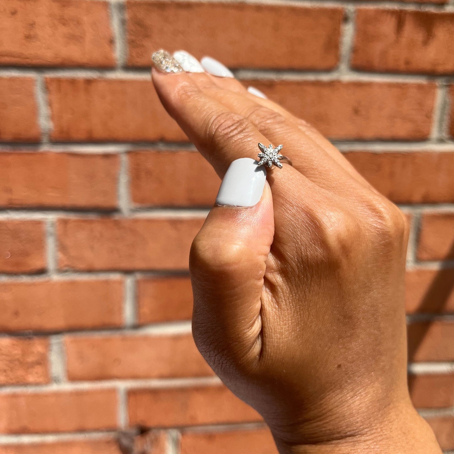 fidget sterling silver ring with  cubic zirconia shaped as a snowflake