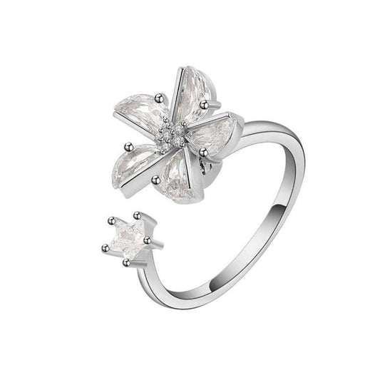 Sterling silver flower fidget ring with start on the other end.